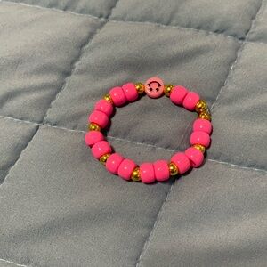 Pink smiley face bracelet